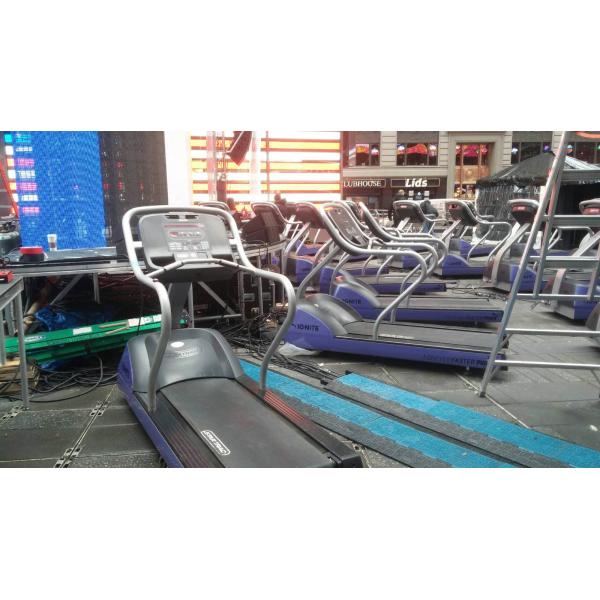 A group of new and remanufactured treadmills in a gym.