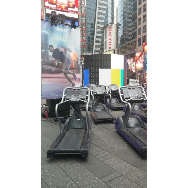 A group of new treadmills in the middle of a city.