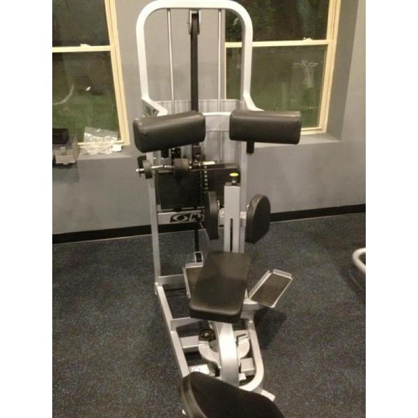 A gym machine in a room with other new equipment.