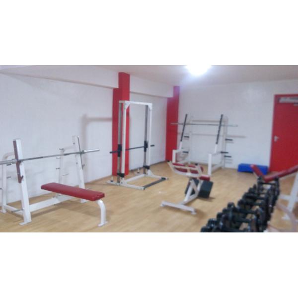 A gym room with an assortment of new and remanufactured weights and equipment.