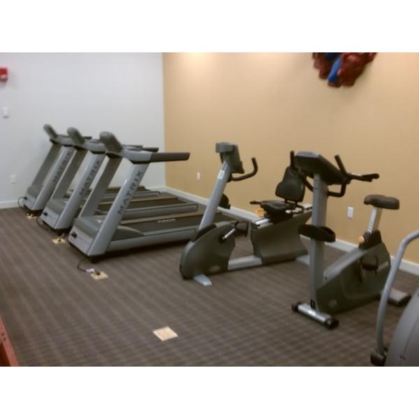 A room filled with a selection of new and remanufactured exercise machines.