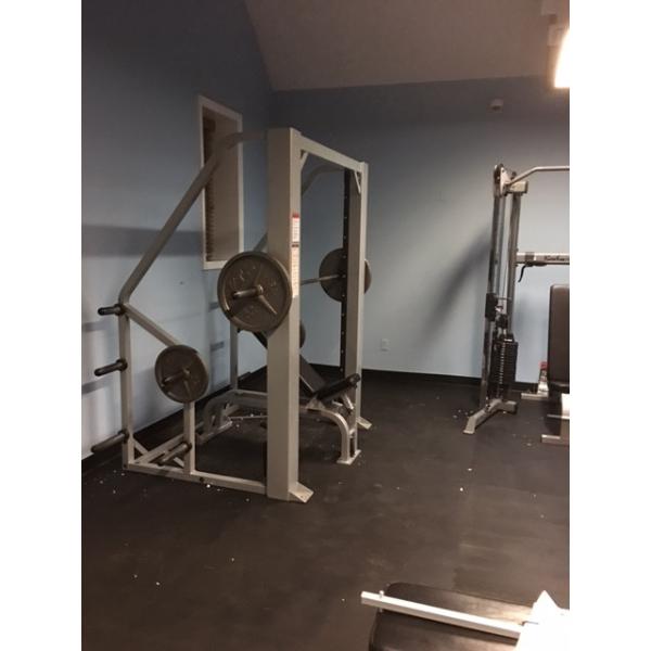 A gym room with new weights and remanufactured equipment.