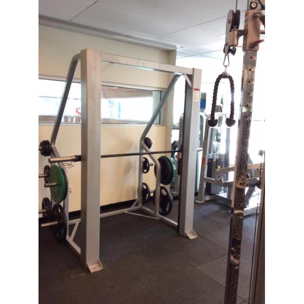 A gym with a new squat rack and other remanufactured equipment.