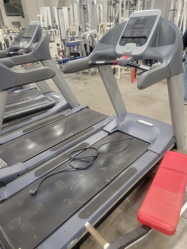 A group of **Precor TRM954i Treadmills- As Is $600** in a gym.