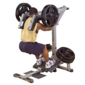 A man performing a squat on the Body Solid Leverage Plate Loaded Squat Calf Machine - New.