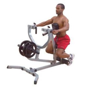 A man performing a squat on a Body Solid Plate Loaded Seated Row Machine - New.