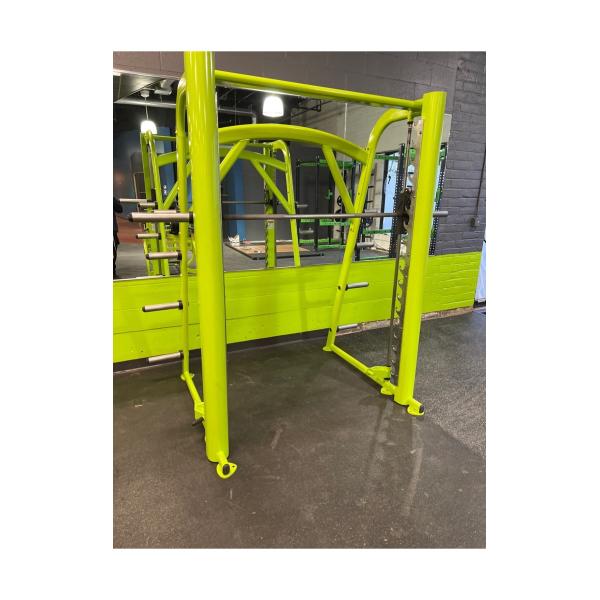 A green metal frame in a gym featuring new gym equipment.