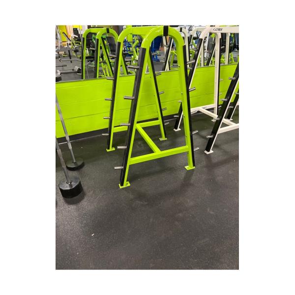 New & remanufactured squat racks in a gym with green mirrors.