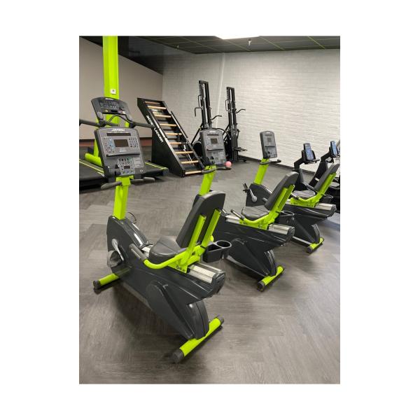 A room filled with a variety of new and remanufactured exercise machines.