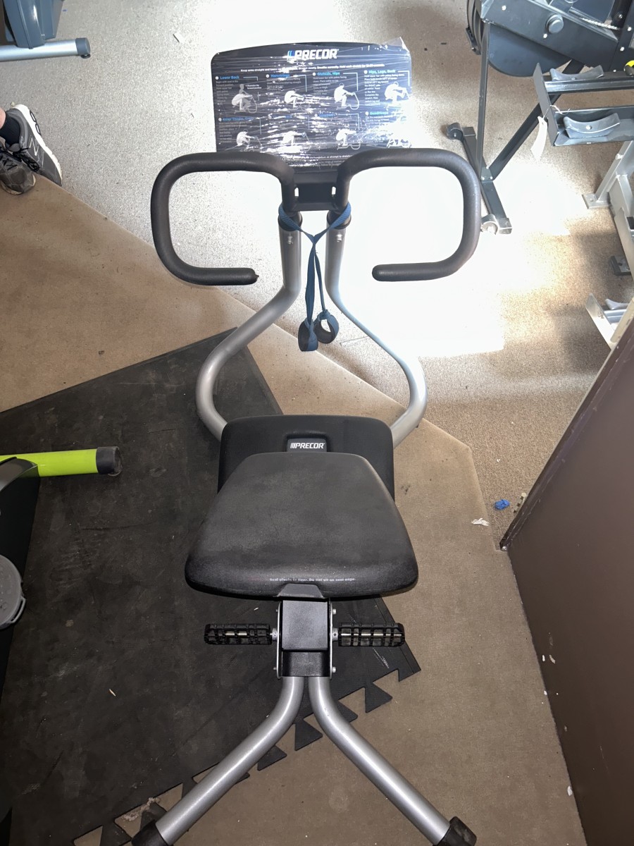 New or remanufactured Precor Stretch Trainer - Serviced elliptical exercise machine in a gym.