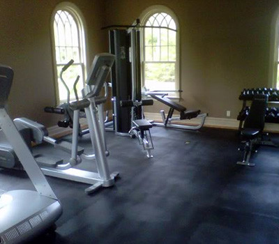 A gym room with a plethora of new and remanufactured gym equipment.