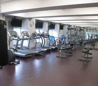 A gym with a wide range of exercise equipment, including new and remanufactured gym equipment.