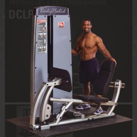 A man is standing in front of a new Body Solid DCLP-SF Pro Dual Leg/Calf Press Machine.