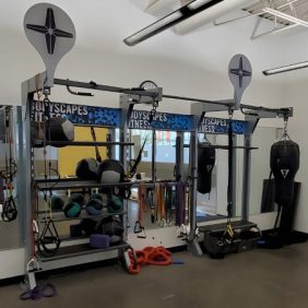 A gym with an assortment of new and remanufactured Gym Rax System - Serviced and other equipment.