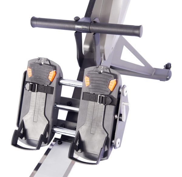 A **Aviron Tough Series Rower - New** rowing machine with two pedals on it.