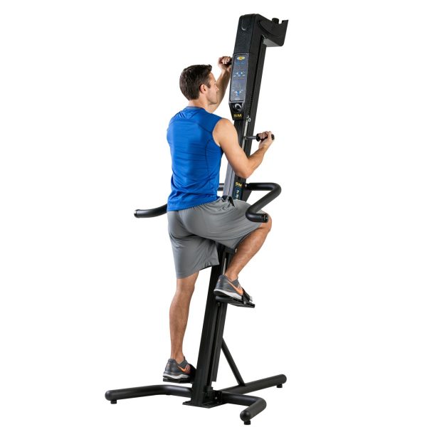 A man is standing on a VersaClimber SM - New exercise machine.