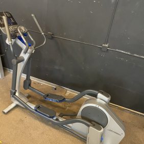 New Elliptical exercise machine in a garage.