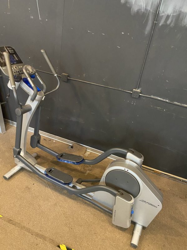 New Elliptical exercise machine in a garage.