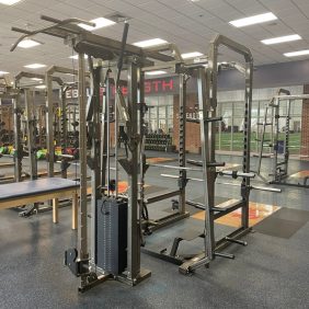 A gym with a lot of new and remanufactured equipment in it.