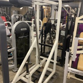 A gym with a wide selection of the Promaxima Plate Loaded Standing Calf - As Is Functional gym equipment.