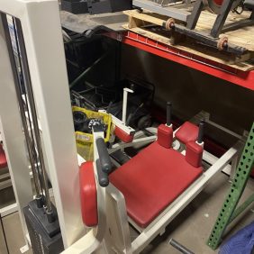 A room filled with the Reebok Lying Leg Press - As Is Functional and remanufactured gym equipment.