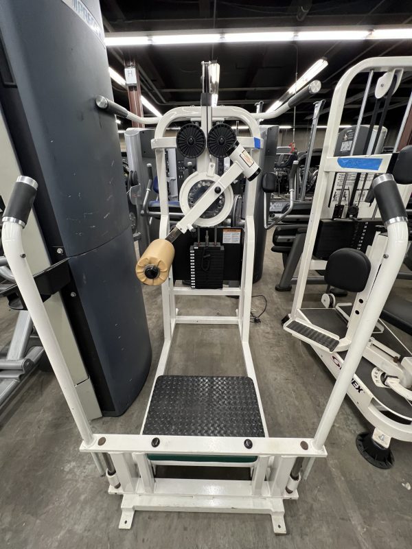 The remanufactured Precor Stretch Machine, featuring diverse handles and steps for functional training, stands on a gray concrete floor, showcasing its versatility.