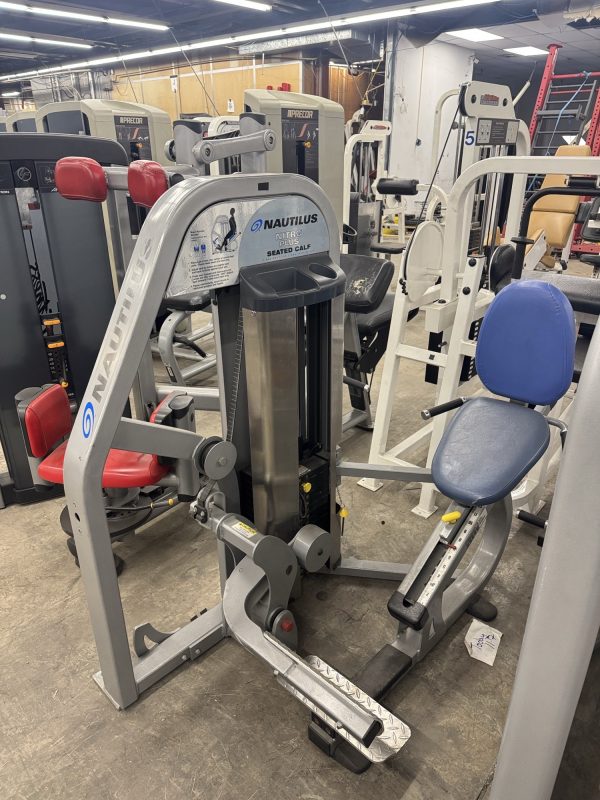 The Nautilus Nitro Plus Seated Calf - As Is Functional machine includes an adjustable seat and foot platform, making it a perfect addition to diverse gym equipment.