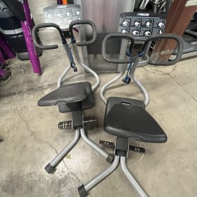 Two remanufactured Precor Stretch Machines grace the gym floor, inviting fitness enthusiasts to engage in a full-body workout.