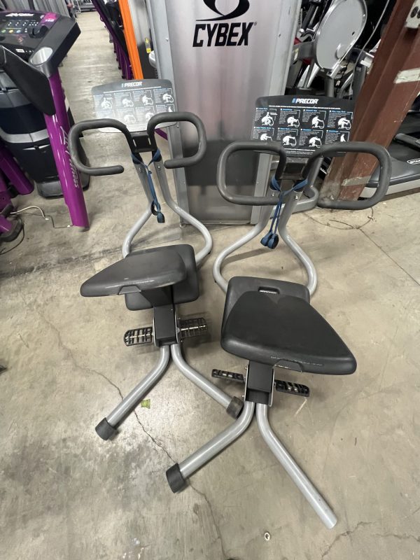 Two remanufactured Precor Stretch Machines grace the gym floor, inviting fitness enthusiasts to engage in a full-body workout.